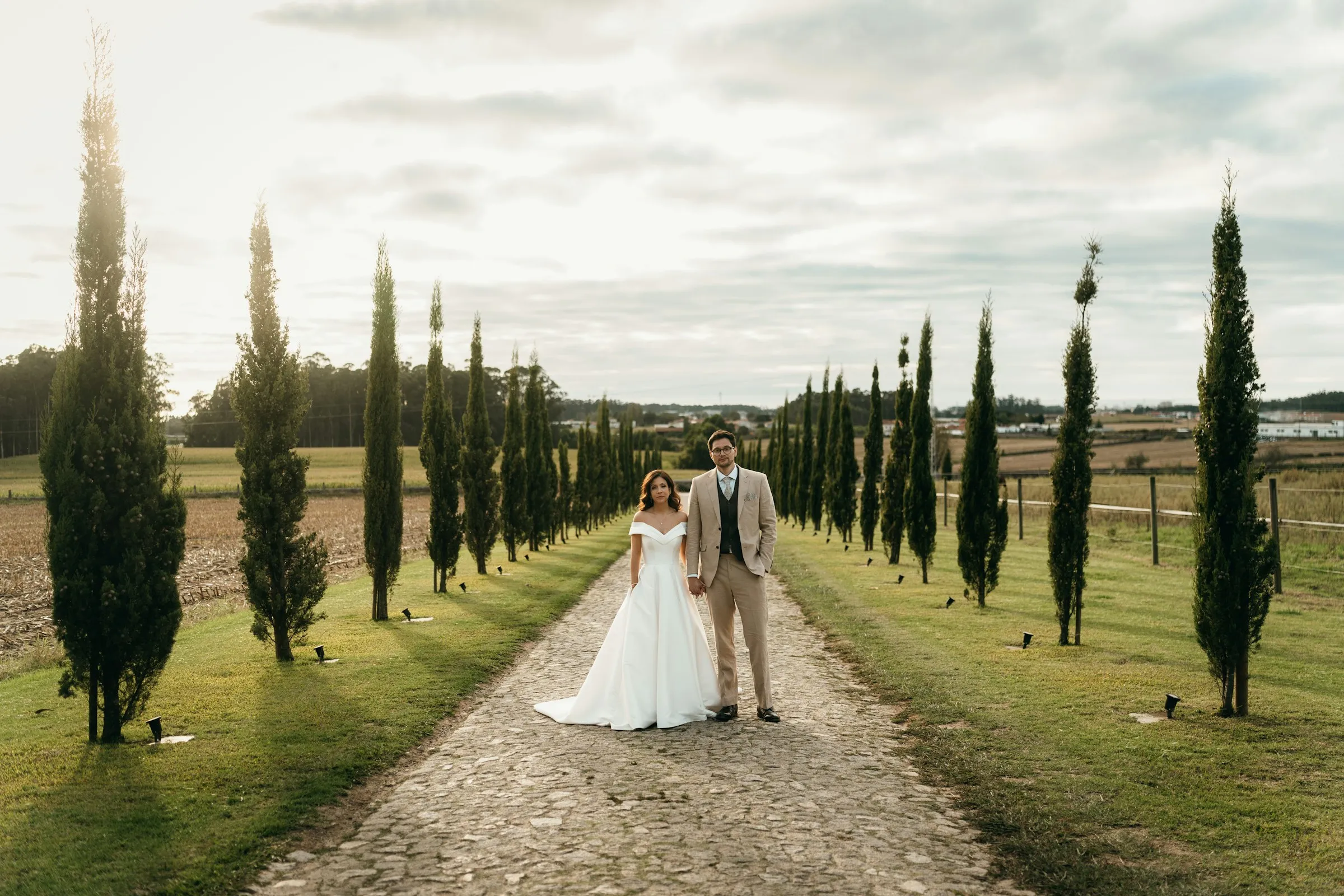 An avenue of cypress trees leading to the house