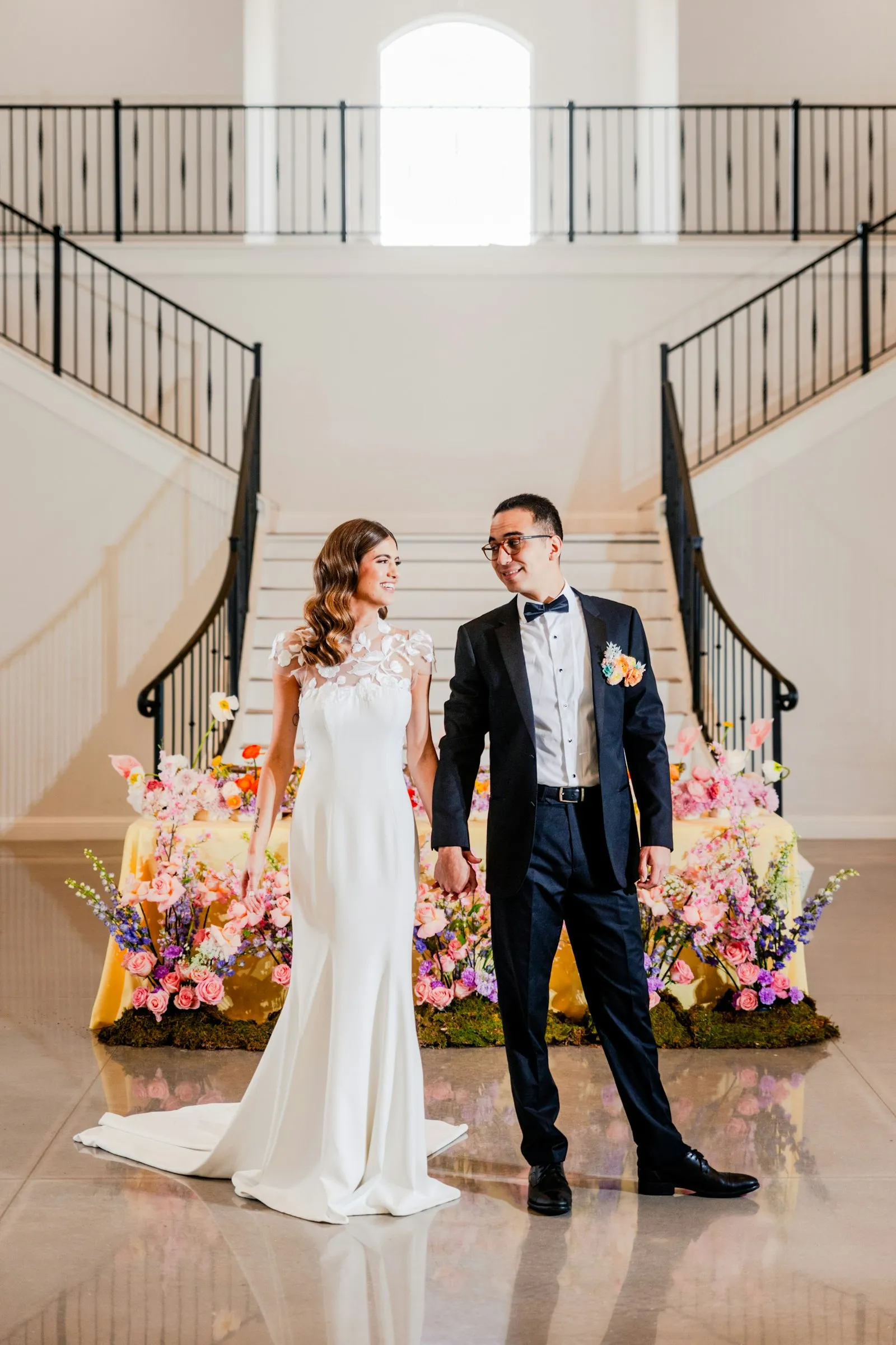 The couple at the foot of a double staircase