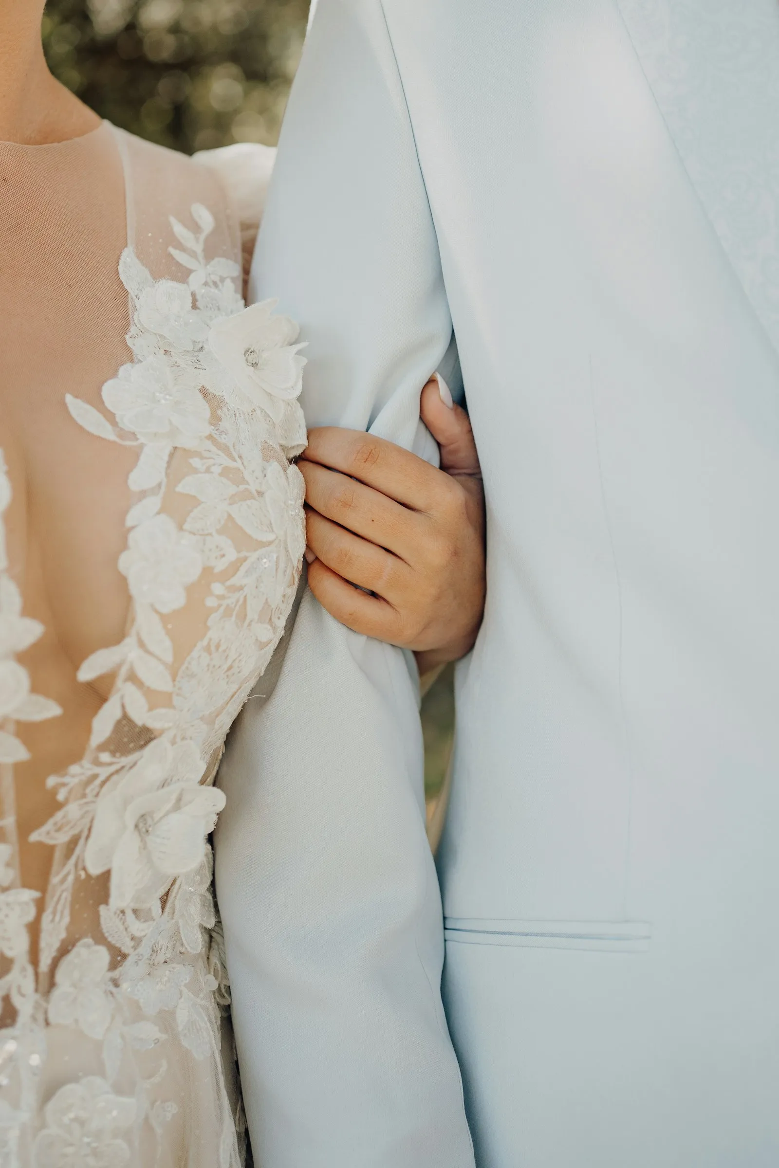 Sophie’s hand resting on Rafael’s arm