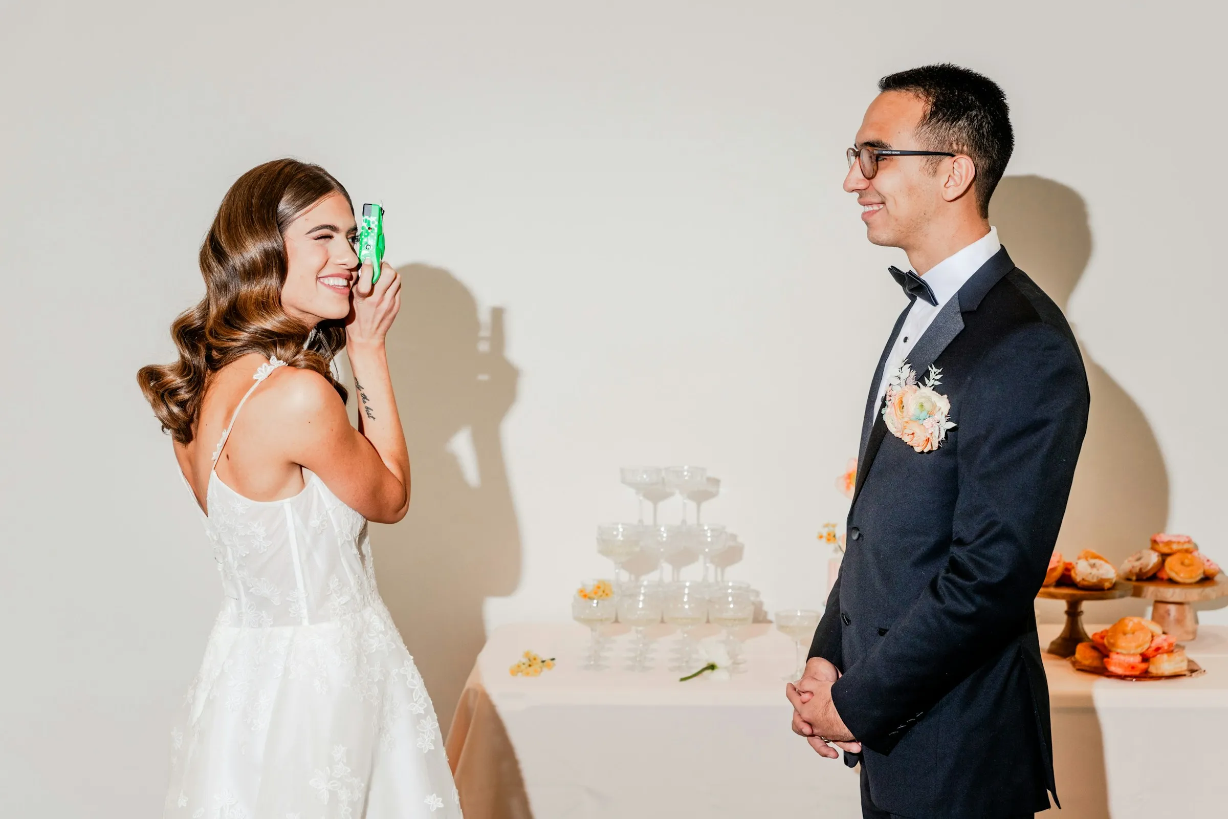 Clara laughing beside the champagne tower