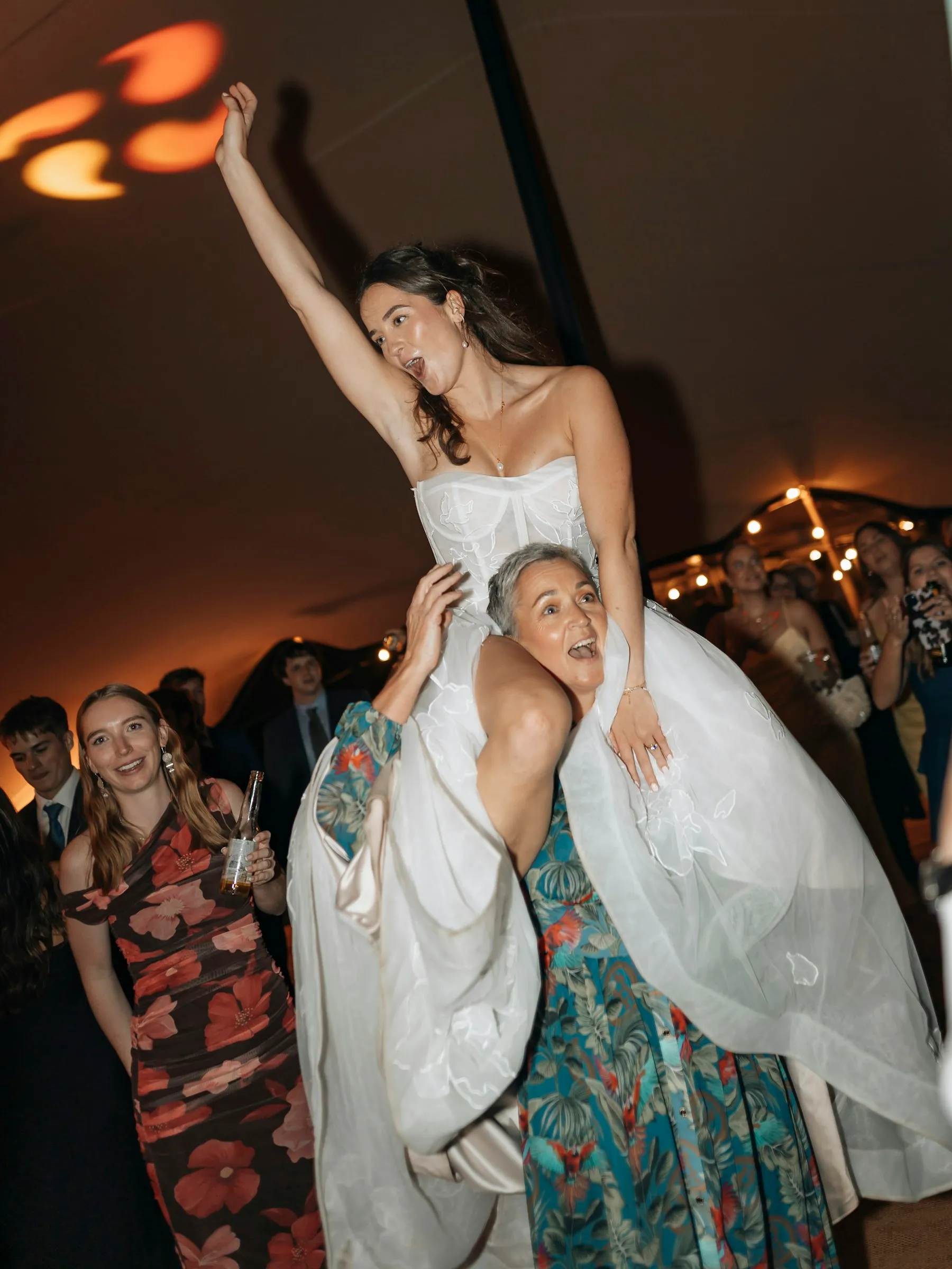 Inês lifted onto shoulders on the dance floor