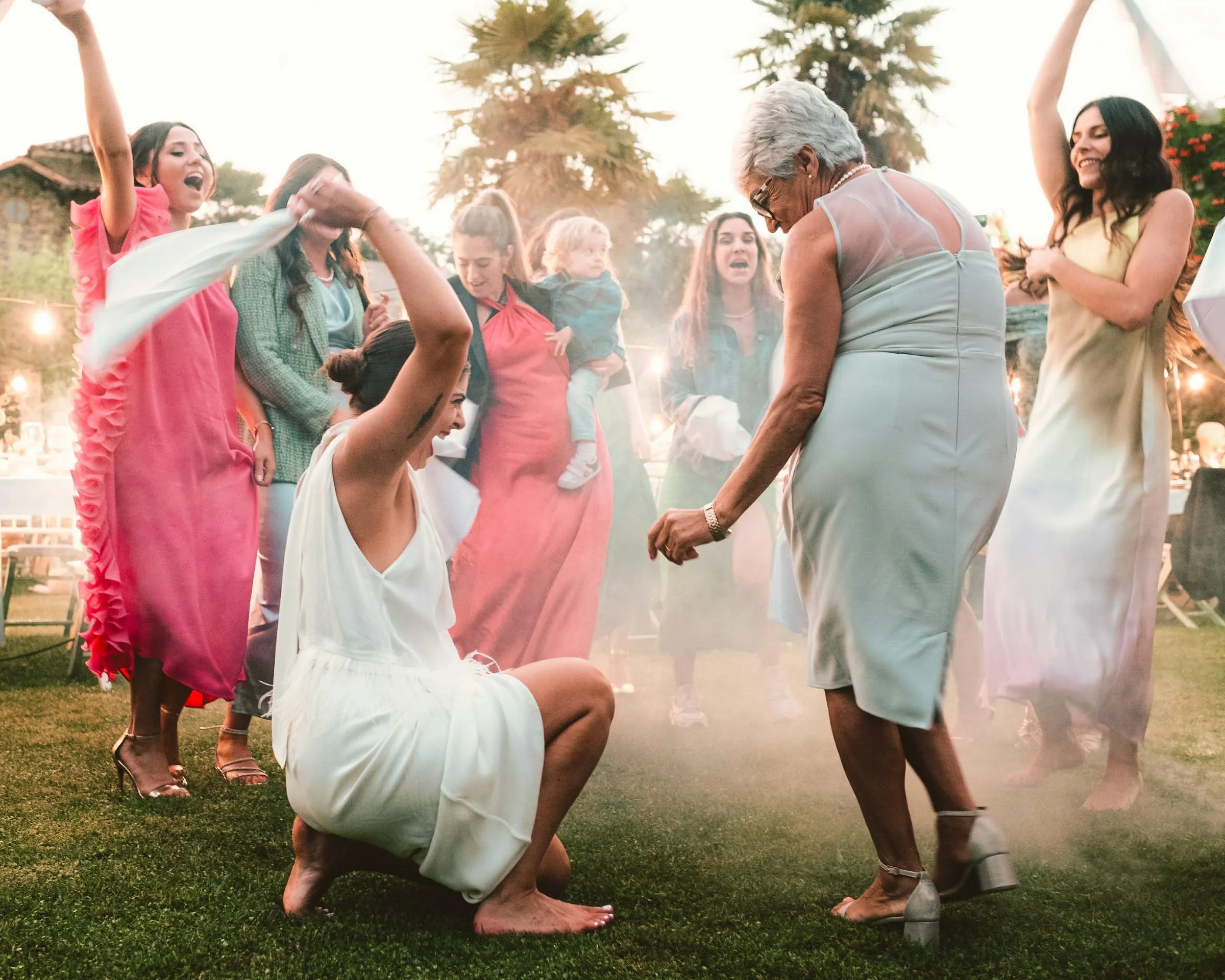 Friends dancing barefoot in the evening haze