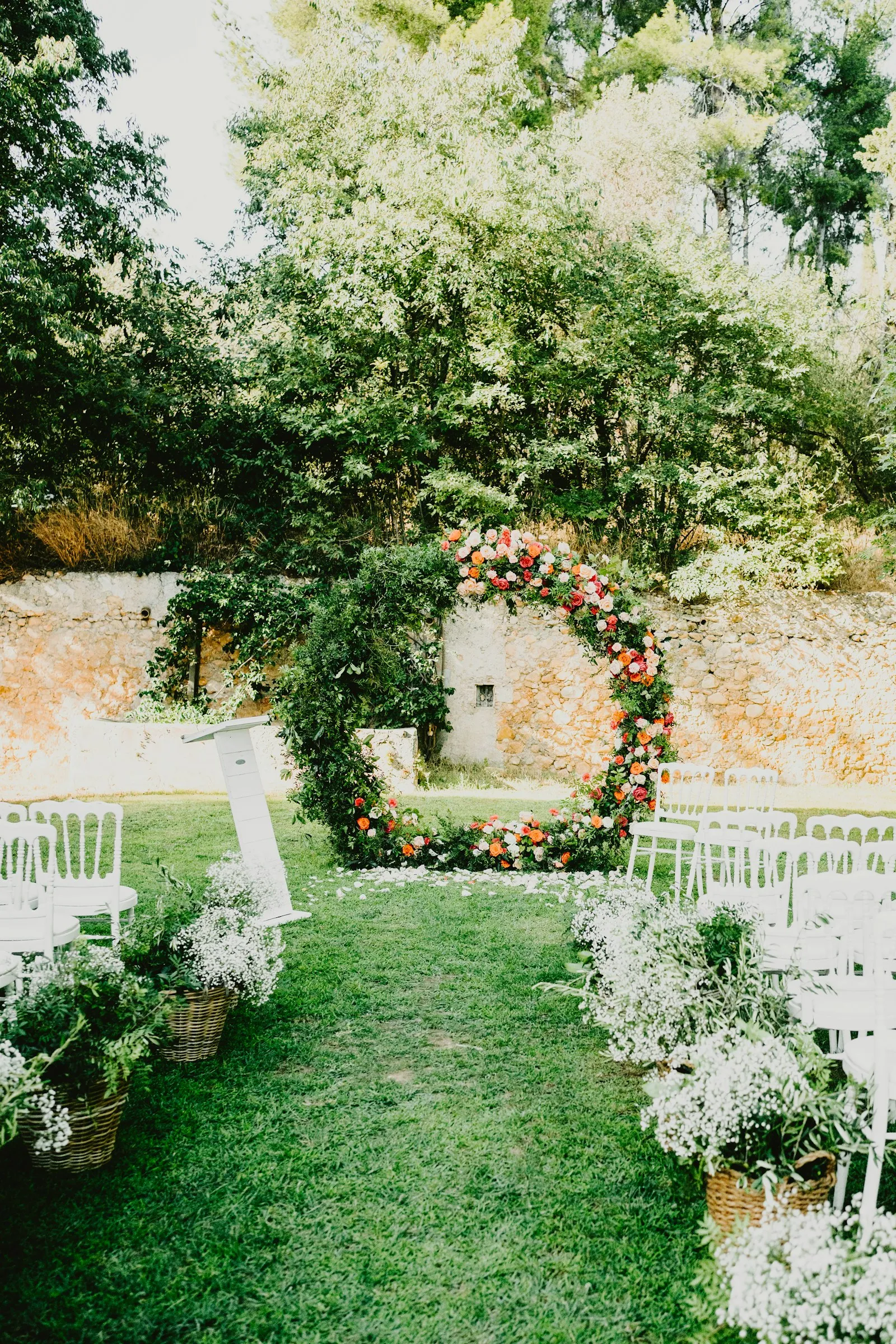 The garden ceremony with a floral arch